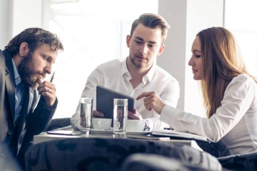 Coworkers have a meeting at restaurant.