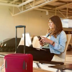 Traveling woman sits in airport