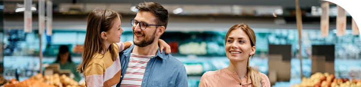 Father carrying baby with wife