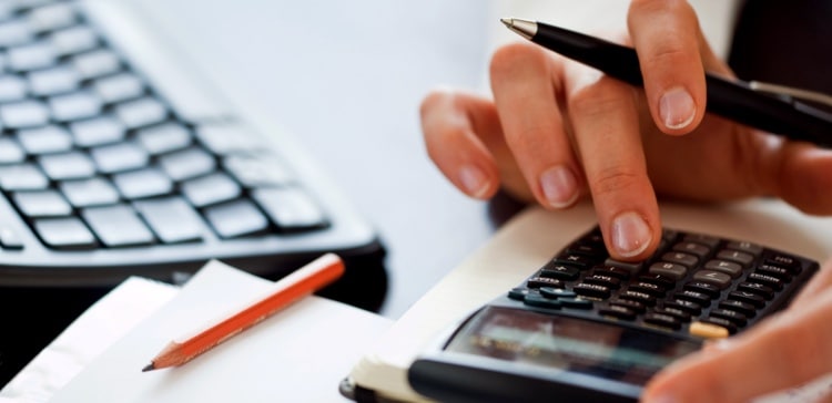 Image of person calculating their finances