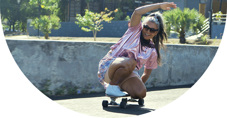 Image of a Woman riding a skateboard