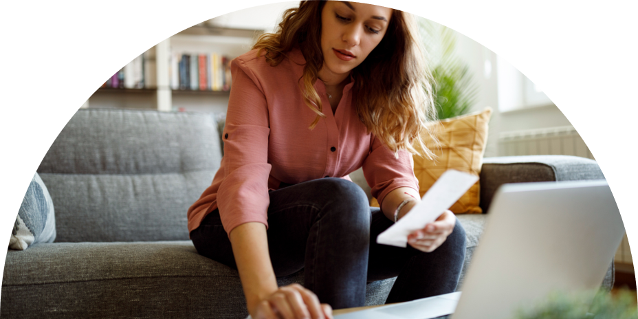Image of woman at her computer working on her bills