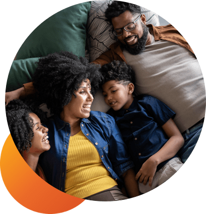 A family enjoying their time as the mother speaks to her laughing kids