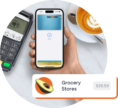 Hand holding mobile device to tap pay