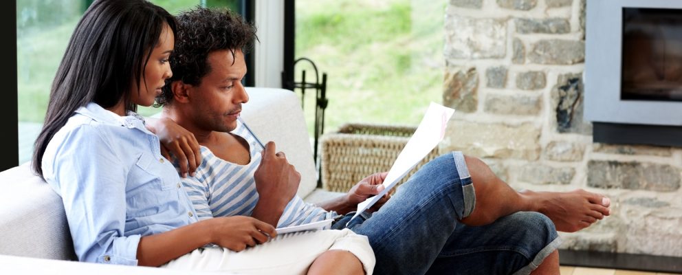 A man and woman review their budget.