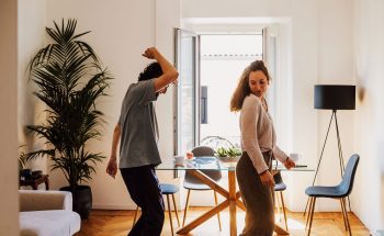 Couple dancing in their kitchen.
