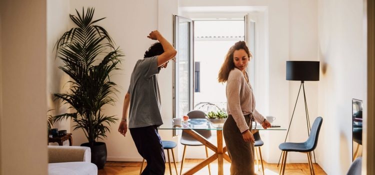 Couple dancing in their kitchen.