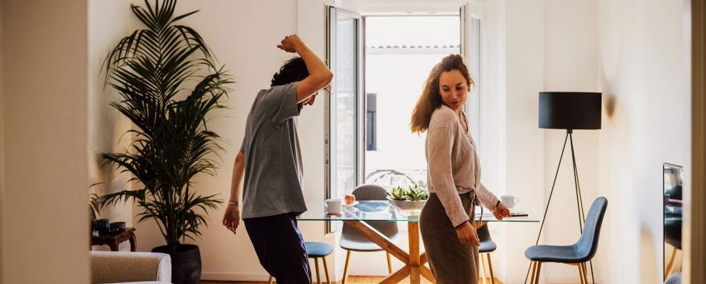 Couple dancing in their kitchen.